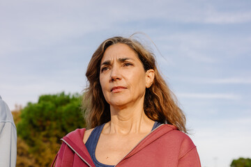 Empowered elderly woman posing with a motivational expression