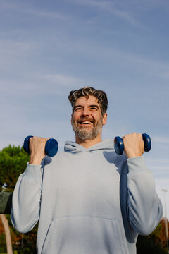 Active adult enjoying a functional workout on a sunny morning