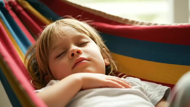 Peaceful Young Child Napping in Colorful Hammock on World Sleep Day, Enjoying a Serene and Restful Nap Indoors with Sweet Dreams