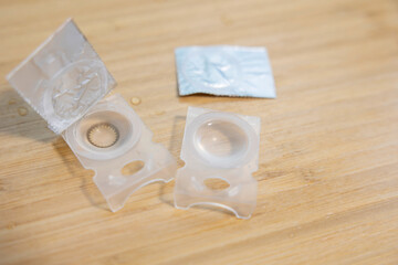 Opened Contact Lens on Table with Copy Space