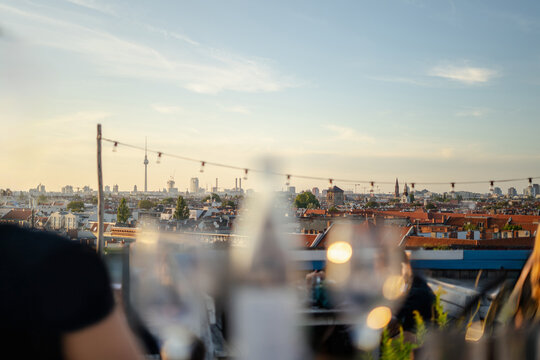 Berlin cityscape during sunset from a rooftop terrace