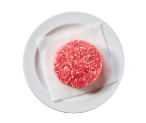 plate with raw ground beef patty for hamburgers isolated on white background, top view.
