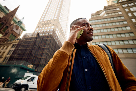 Man makes a call on the street