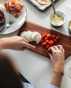 Close-up of Hands Slicing Mozzarella for Pizza