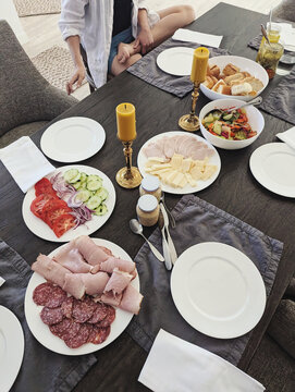 Gathering Around a Beautifully Set Table for a Meal With Friends