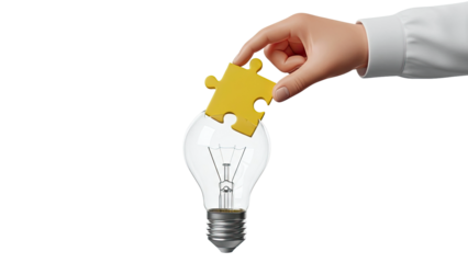 Hand placing puzzle piece into light bulb for new idea
