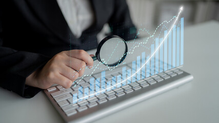 A professional use of technology for analyzing business growth trends with data visualization tools in a modern workspace, emphasizing financial strategies. Impute