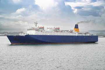 Caribbean Sea ferry boat in motion, cutting through azure waters toward a lush tropical island destination