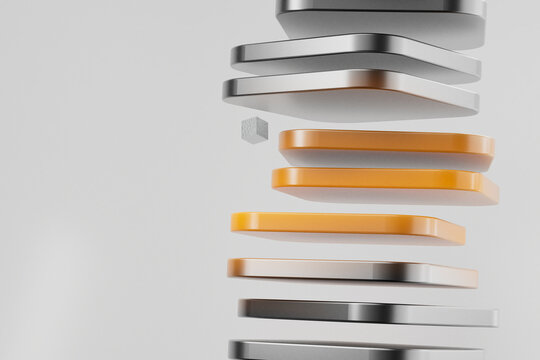 Close-up of abstract floating orange and metal square shapes