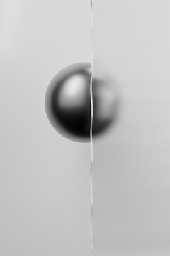 Front view of split metallic sphere with blur effect