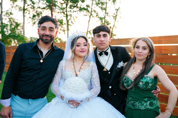 Gypsy Newlyweds Posing with Family After the Ceremony