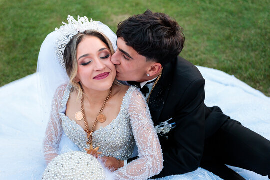 Groom Kissing His Bride in a Tender Wedding Moment