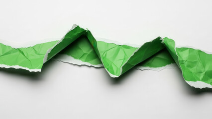 Torn green paper edge revealing a white background creating a jagged line
