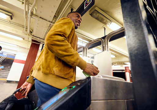 Man passes the gate in the subway