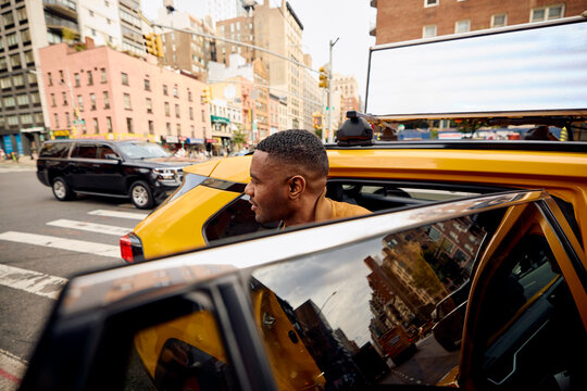 Passenger exits taxi