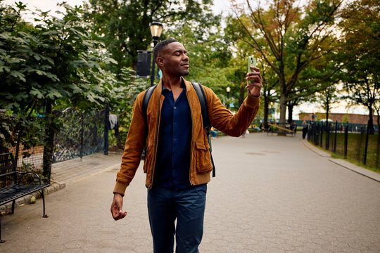 Man takes photos in the park