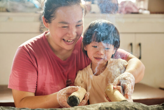 Chinese mother and daughter experience moxibustion during treatment