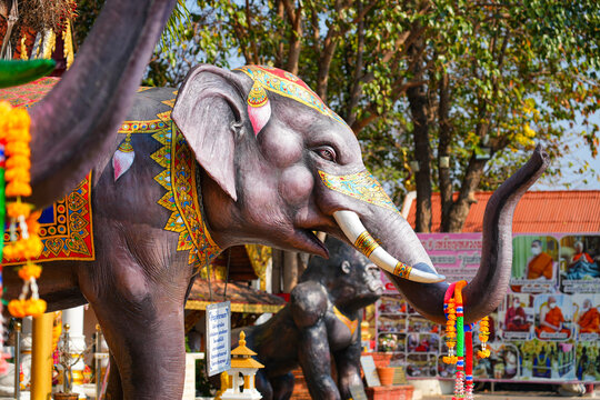 Ornately decorated sacred elephant statues at Wat Phra That Doi Kham temple on the mountain side of Chiang Mai, Northern Thailand