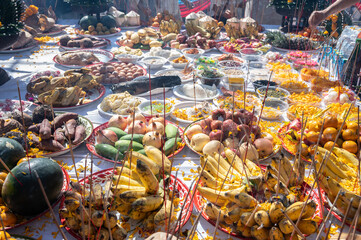 Various kind of food on table offering to the god or angel in mixed culture of Buddhist and Hindu religion in Thailand. Offerings, which can be flowers, food, or other gifts, are part of puja (worship