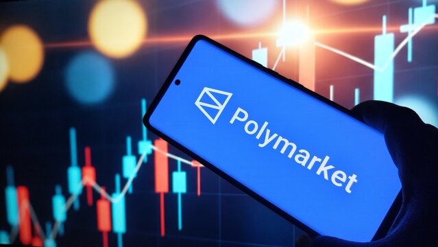 Polymarket logo on smartphone screen with stock market graph background