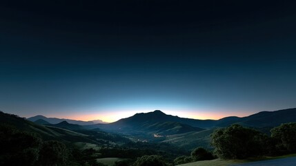 Fototapeta premium Serene Mountain Landscape at Twilight with Vibrant Horizon Illuminating the Peaceful Valley and Rolling Hills Under a Starry Sky