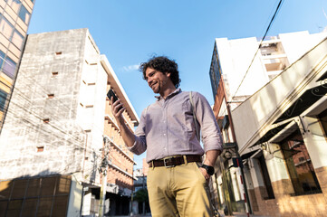 Professional traveler using smartphone in downtown