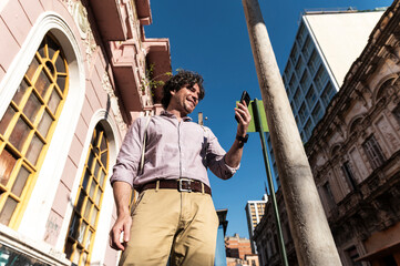 Confident traveler video calling outdoors