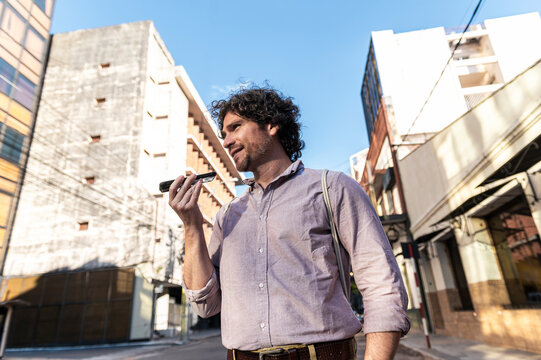 Candid moment of man recording voice message