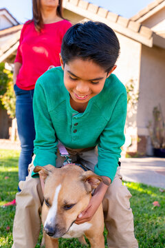 petting dog outside house
