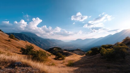 Scenic Landscape of Rolling Hills and Valley Under a Bright Blue Sky with Fluffy Clouds and Gentle Sunlight in Nature's Serene Beauty