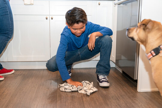 boy cleaning floor