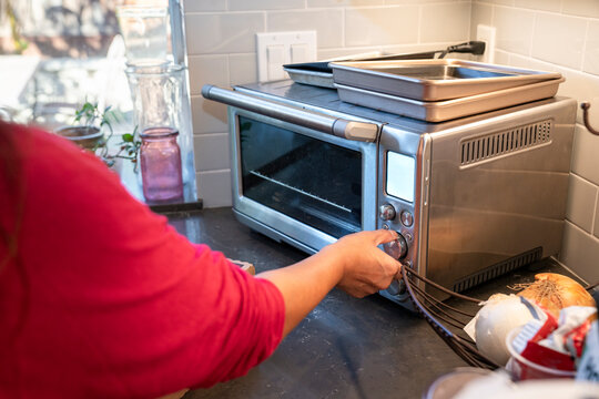 Cooking in a Modern Kitchen Using a Toaster Oven