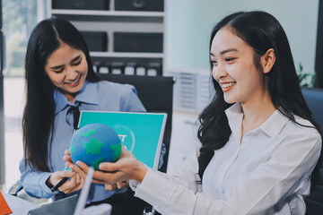 Hands of adult Asian business professionals analyzing ESG financial data and renewable energy project plans
