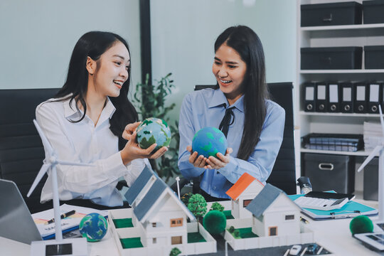 Hands of adult Asian business professionals analyzing ESG financial data and renewable energy project plans - Powered by Adobe