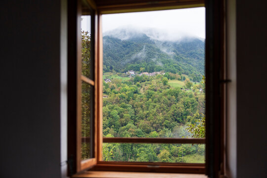 Peaceful Mountain Landscape View Through Wooden Window