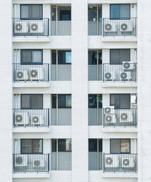 Apartment Building Facade with Air Conditioners and Balconies