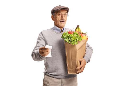 Shocked elderly man looking at a receipt for grocery shopping