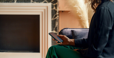 Anonymous woman scrolling on blank screen .
