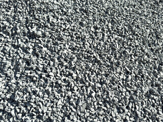 Close-up full frame texture of small gray crushed stone gravel