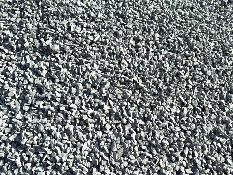 Close-up full frame texture of small gray crushed stone gravel