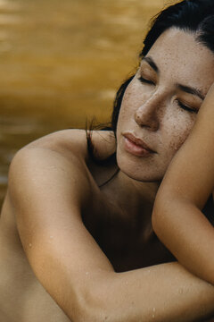 Dark Brunette Woman's Portrait with a lot of freckles