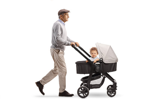 Grandfather pushing baby boy in a stroller