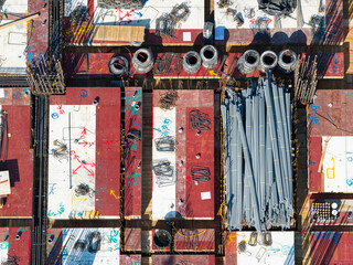 Aerial View of Construction Site with Rebar and Building Materia