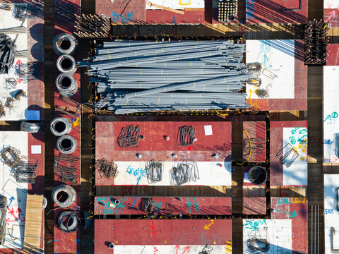 Aerial View of Construction Site with Rebar and Building Materia