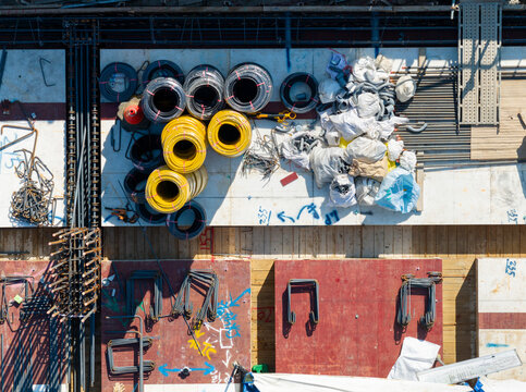 Aerial Construction Site with Coiled Hoses and Materials