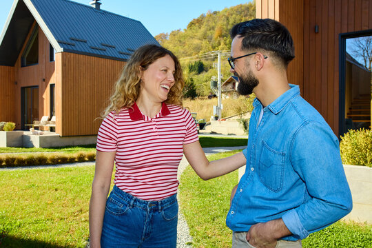 Couple talking in front of the cabin