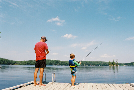 Father and Son Fishing Together at the Lake