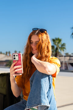 Happy woman with phone blue skye