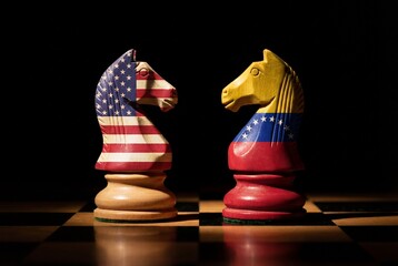 USA and venezuela flags on chess knights representing political conflict strategy