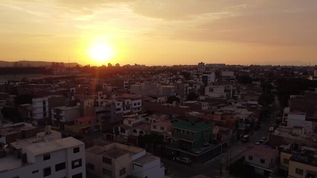 Sunset over lima skyline golden hour aerial view of residential neighborhoods and low rise buildings